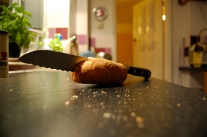 Image of bread knife stuck in a stale roll